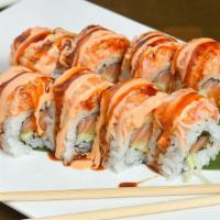 American Roll · Spicy salmon, crunch, cucumber inside, top with spicy crab meat.