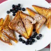 French Toast · Served with butter and syrup.