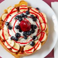 Tutti Frutti Waffle · With strawberries, bananas, and raisins. Served with butter and syrup.