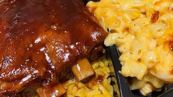 Bbq Ribs Soul Platter  · Slow Cooked BBQ Pork Ribs served over Seasoned Yellow Rice with a side of Candied Yams and Baked Mac & Cheese.