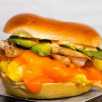 Bagel, Smoked Turkey, Avocado, Egg, & Cheddar Sandwich · 2 scrambled eggs, melted Cheddar cheese, sliced smoked turkey, avocado, and Sriracha aioli o...