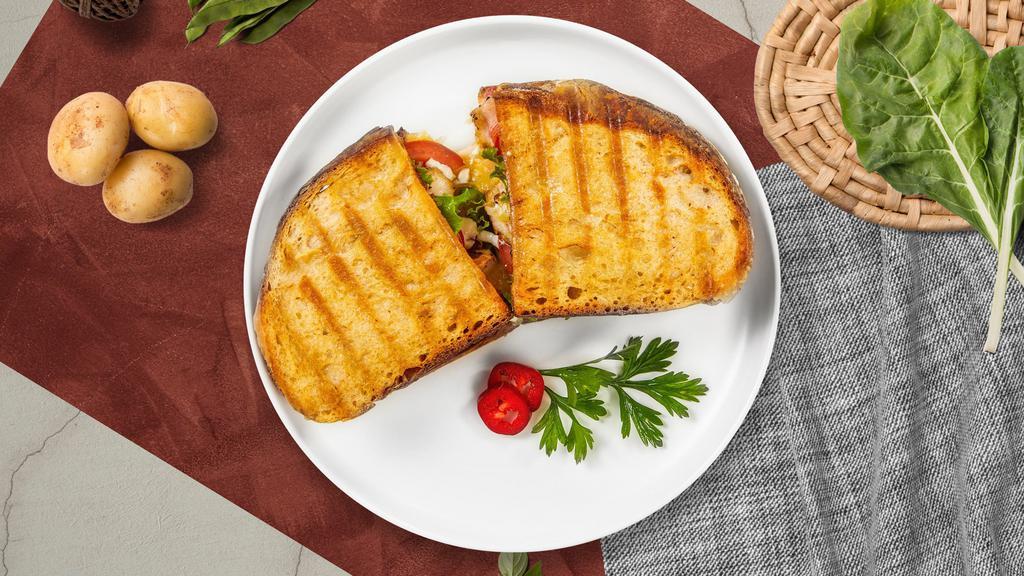 Super Italiano Panini · Grilled chicken, mozzarella cheese, roasted peppers, and pesto sauce on your choice of toasted bread.