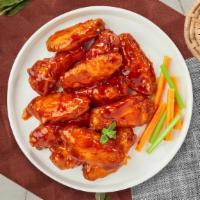 Funfire Buffalo Wings · Fresh chicken wings fried and tossed in our buffalo wing sauce. Served with your choice of d...