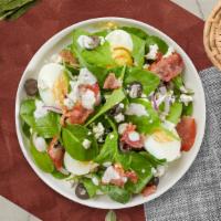 Poppy'S Spinach Salad · Bed of baby spinach with selected toppings.