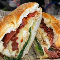 Maggies Farm Sandwich · Three egg whites, spinach, bacon, and swiss