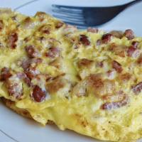 Meatlovers Omelette · Bacon, sausage, ham, and cheddar cheese.
Comes with Homefries & Toast