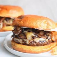 The Mushroom Burger · Topped with sauteed mushrooms, onions, and melted swiss.