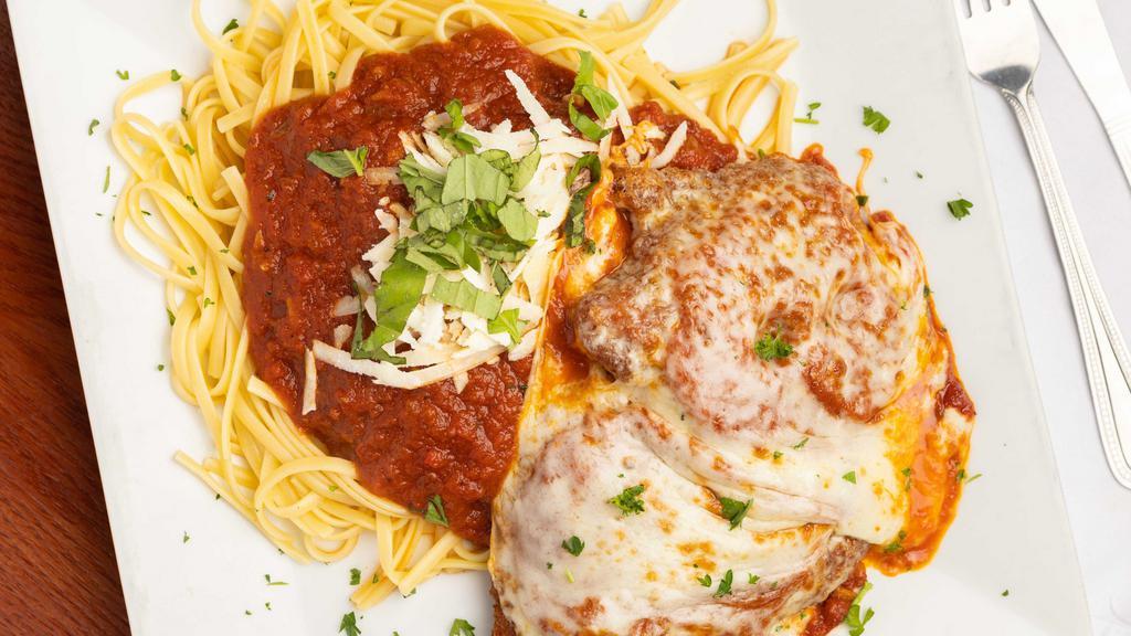 Chicken Parmesan · Two breaded cutlets with homemade sauce parmesan and side of linguine.