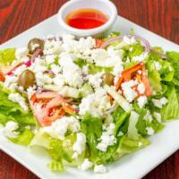 Greek Salad · Romaine lettuce, onion, olives, tomatoes, cucumber and feta cheese.