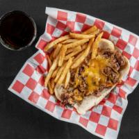 Phillie'S Cheese Steak · Shaved steak topped with peppers, onions and melted cheddar cheese.