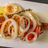 Escoviche Red Snapper · Seasoned whole snapper fried and garnished with a vinegar sauce of hot peppers, onions, carr...