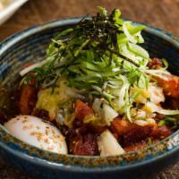 Tteokbokki · Rice cakes browned in butter with bacon and minced pork. Topped with poached egg, scallion, ...