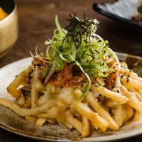 Disco Fries · Crispy shoestring fries topped with pork gravy, mozzarella, kimchi, scallions, sesame seeds,...