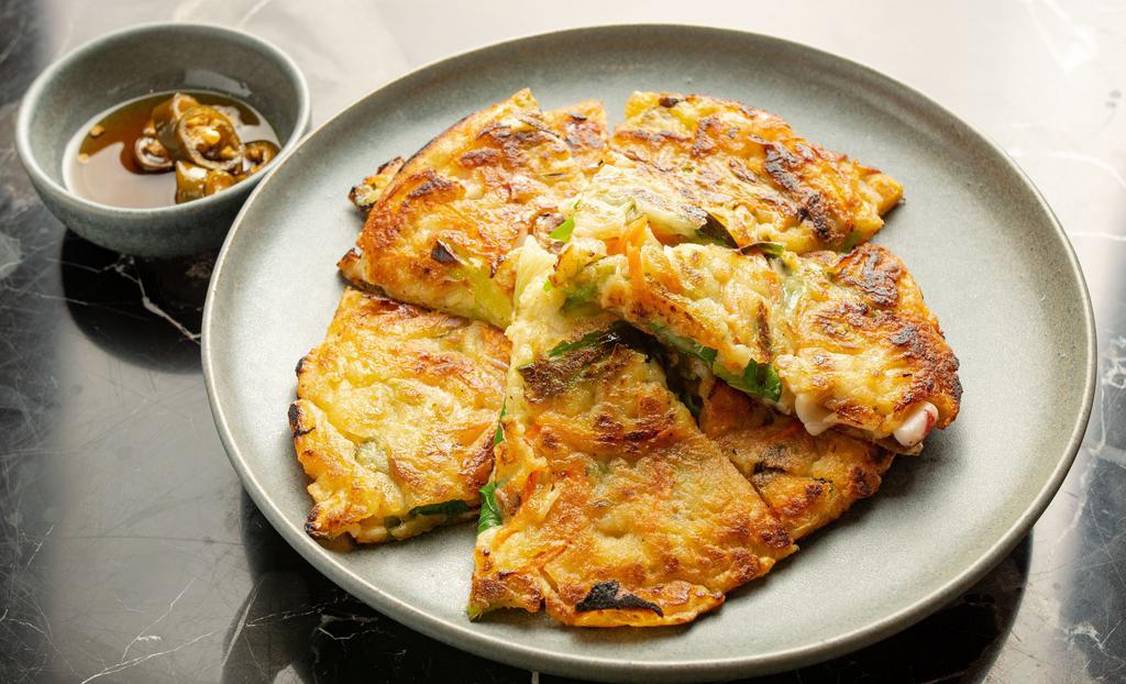 Pajeon · Three pieces of Korean pancake with choice of toppings.