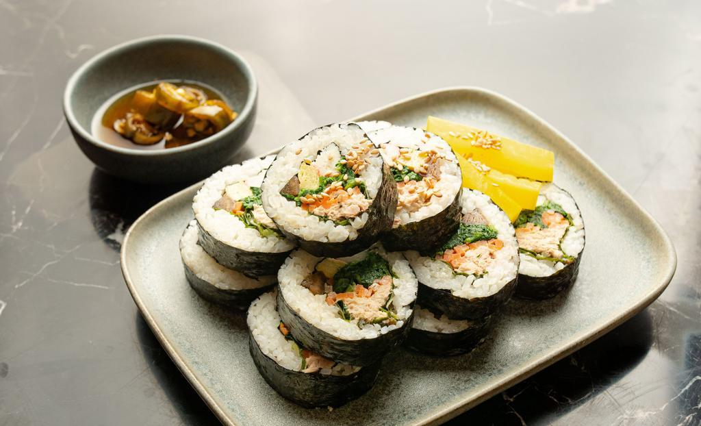 Kimbap · Korean rice roll. Vegetables, egg, and crab sticks with a choice of toppings rolled with dried seaweed paper.