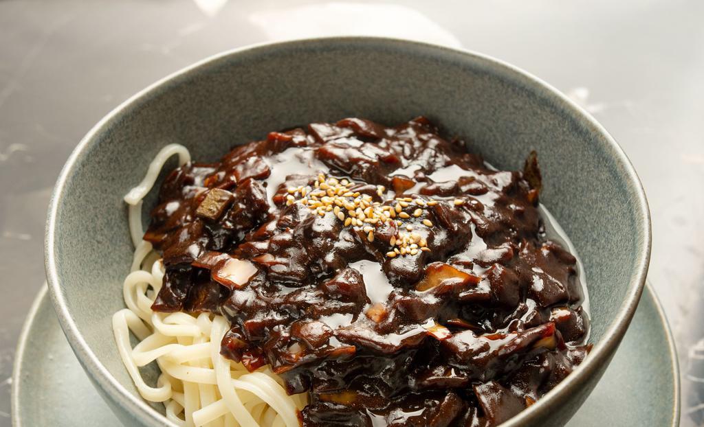 Jja Jang Myun · Black bean noodle. Ko-china noodles over stir-fried black bean paste with vegetable and choice of toppings.
