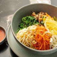 World Best Bibimbap · Sauteed and seasoned vegetables over rice served with fried egg and OHHO spicy sauce. Add bu...