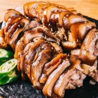 Jok Bal · Pig’s trotters cooked with housemade special soy sauce and spices served with jalapeno peppe...
