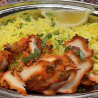 Tikka Lemon Fried Rice · Mixture of mustard seed, green peas, lemon juice and topped with chicken tikka with rice.