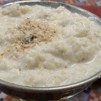 Rice Pudding · Traditionally cooked rice with milk and nuts.