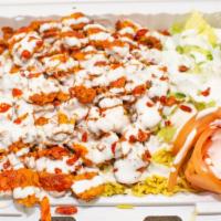 Chicken Over Rice · SERVER WITH RICE AND SALAD  WHITE SAUCE AND HOT SAUCE ON THE SIDE