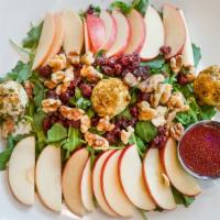 Swick Salad · Baby arugula, Fuji apples, dried cranberries, goat cheese covered with pistachios plus raspb...