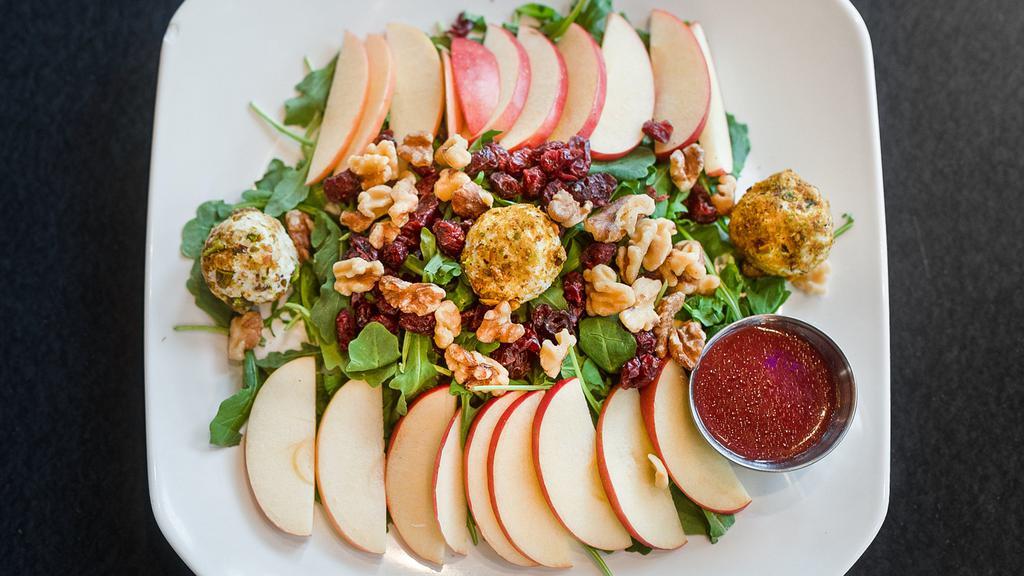 Swick Salad · Baby arugula, Fuji apples, dried cranberries, goat cheese covered with pistachios plus raspberry vinaigrette.