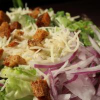Caesar Salad · Romaine lettuce, onions, Parmesan cheese and homemade croutons.
