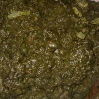 Saag Gosht · Spiced lamb chunks, creamed spinach and ginger. Comes with rice.