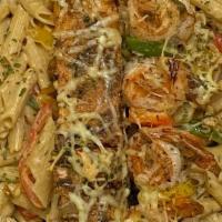 Salmon & Shrimp Casa Pasta · Salmon and shrimp marinated and chargrilled in jerk seasonings in a creamy alfredo sauce wit...