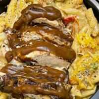 Jerk Chicken Casa Pasta · Chicken marinated and grilled with jerk seasonings in a creamy alfredo sauce with penne past...