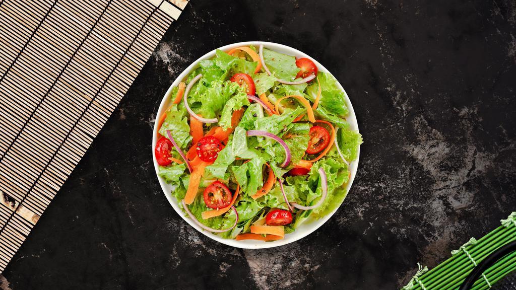Classic House Salad · (Vegetarian) Romaine lettuce, cucumbers, cherry tomatoes, carrots, fresh bell peppers, and onions dressed tossed with lemon juice & olive oil.