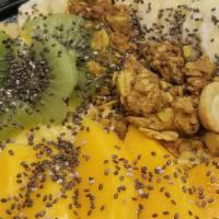 Tropical Turmeric Bowl · Pineapple, Banana, Mango. Topped with: Turmeric Granola ( has cashew pieces), Mango, Kiwi, B...