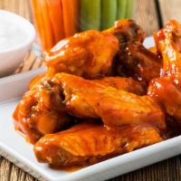 Buffalo Chicken Wings · Chicken wings deep fried to perfection and smothered in buffalo sauce. Served with celery, c...