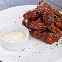 Extra Hot Chicken Wings · Chicken wings deep fried to perfection and smothered in extra spicy sauce. Served with celer...