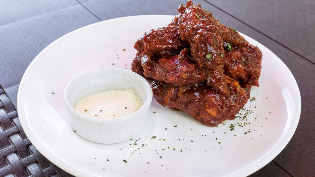 Extra Hot Chicken Wings · Chicken wings deep fried to perfection and smothered in extra spicy sauce. Served with celery, carrots, and dipping sauce.