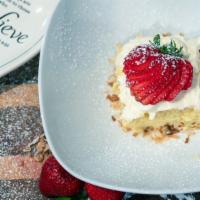 Strawberry Tres Leches Cake · Tres leches cake with strawberries.