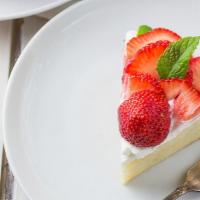 Strawberry Tres Leches Cake · Tres leches cake with strawberries.