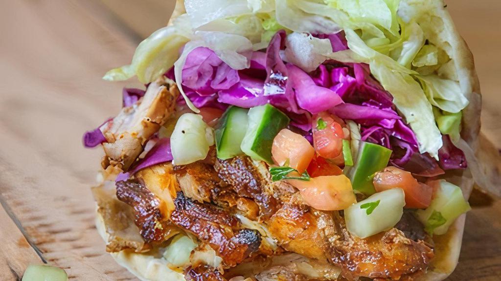 Perfect Pita · Shawarma, hummus, Israeli salad, red cabbage, lettuce, and tahini.