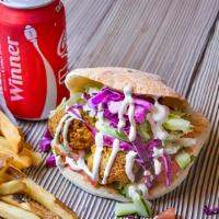 The Dream · Falafel pita, hummus, Israeli salad, lettuce, red cabbage, tahini, french fries, and your ch...