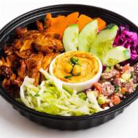 Shawarma Bowl · Fire-roasted marinated chicken thighs.