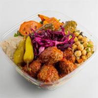 Vegan Meatballs Greens · Vegan Moroccan Style Meatball baked and marinated in slightly spicy Moroccan Sauce.