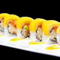 Bahamas Roll · Spicy salmon with apple crunch inside mango on top with home made mango sauce.