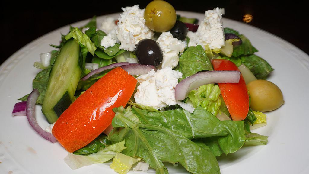 Greek Salad · mixed greens, tomatoes, cucumbers, peppers, red onions, olives, feta cheese