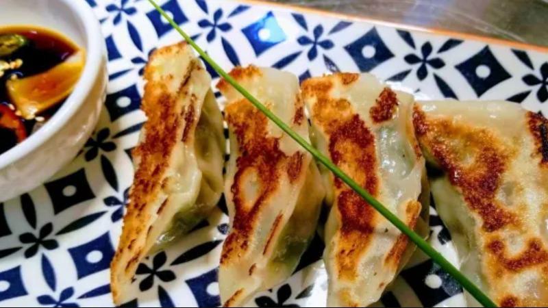 Mandoo · Homemade dumplings filled with pork and vegetable.