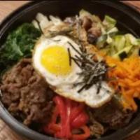 Bulgogi Bibimbap · Assorted vegetables and bulgogi, topped with fried egg. Served with miso soup and rice.