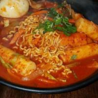 Army Stew · Hot. Spicy stew with pork, kimchi, vegetables, ham, sausage, tofu, rice cakes and ramen nood...
