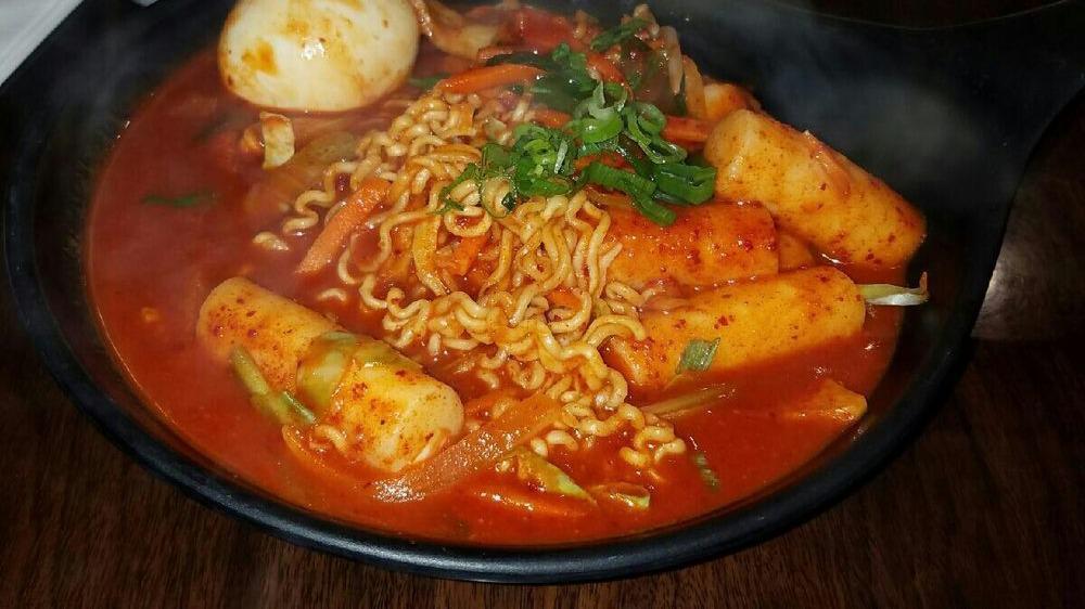 Army Stew · Hot. Spicy stew with pork, kimchi, vegetables, ham, sausage, tofu, rice cakes and ramen noodles. Served with rice and kimchi.