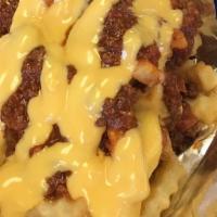 Chili Cheese Fries · Our famous cheese fries topped
With our delicious chili.