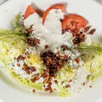 Iceberg Wedge Salad · Topped with blue cheese dressing, plum tomatoes, gorgonzola cheese & crumbled crisp bacon.